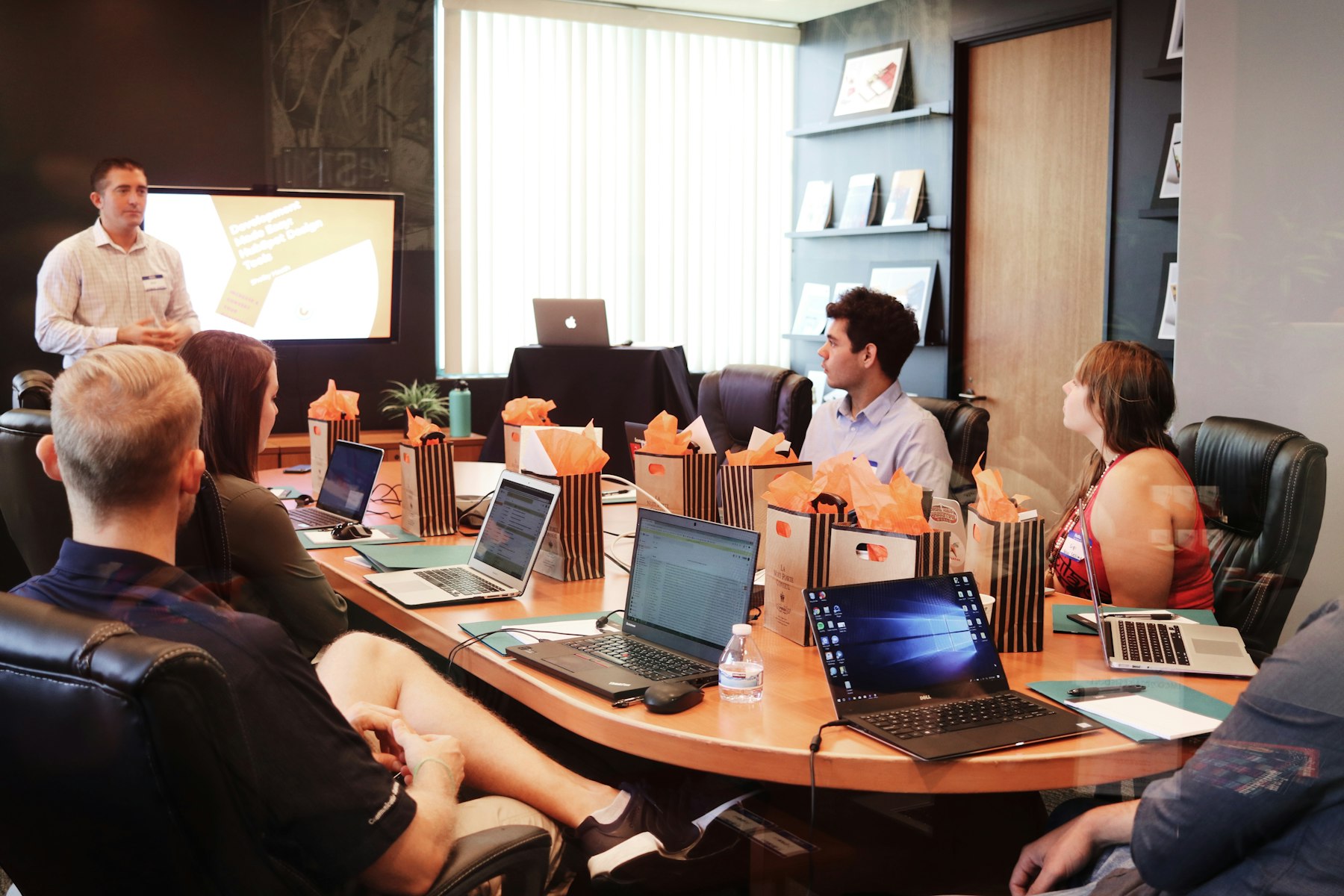 A real photograph of communications operations room with warm gold details
