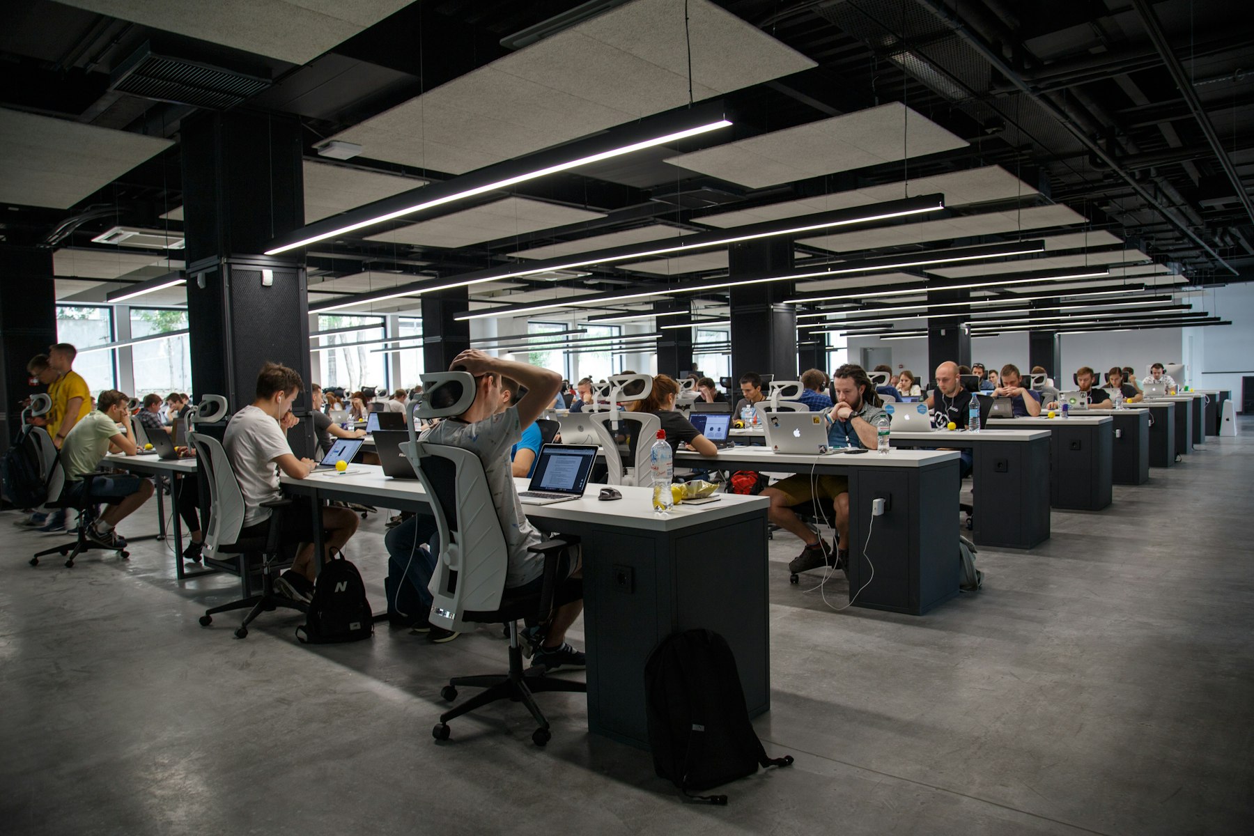 A real photograph of calm communications operations room with warm central lighting